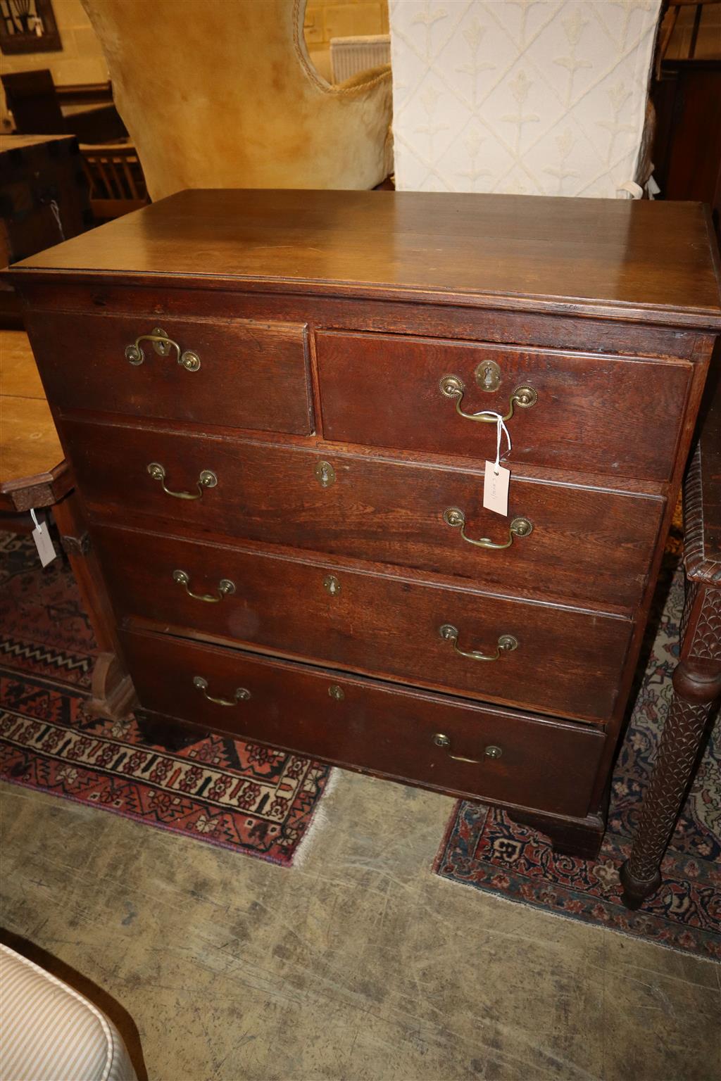 A George III oak chest of drawers, width 93cm, depth 51cm, height 100cm